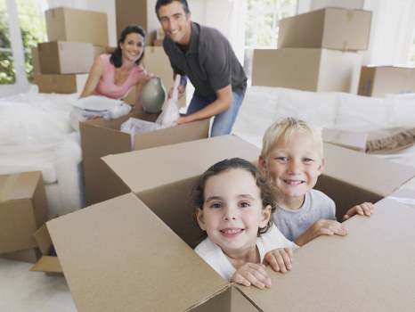 Removal van and moving team outside a Blackfen home