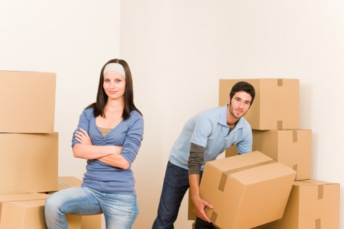 Furniture and boxes being loaded into a moving van in Blackfen