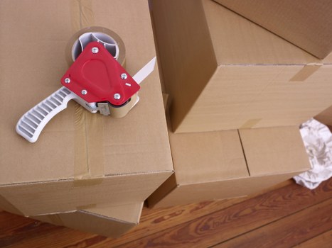 Removal van and moving team working on a residential Blackfen street