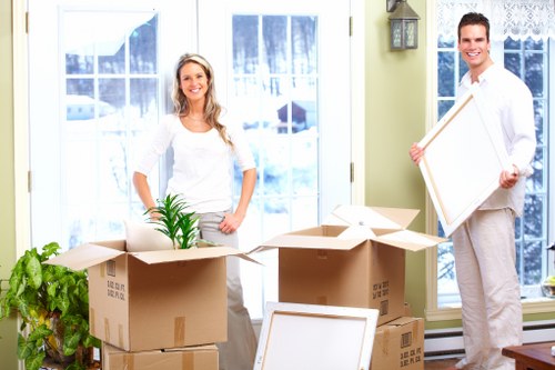 Packed moving boxes and careful loading for a house move near Blackfen